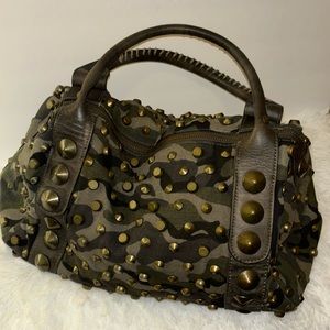 Camouflage print bag with bronze hardware.